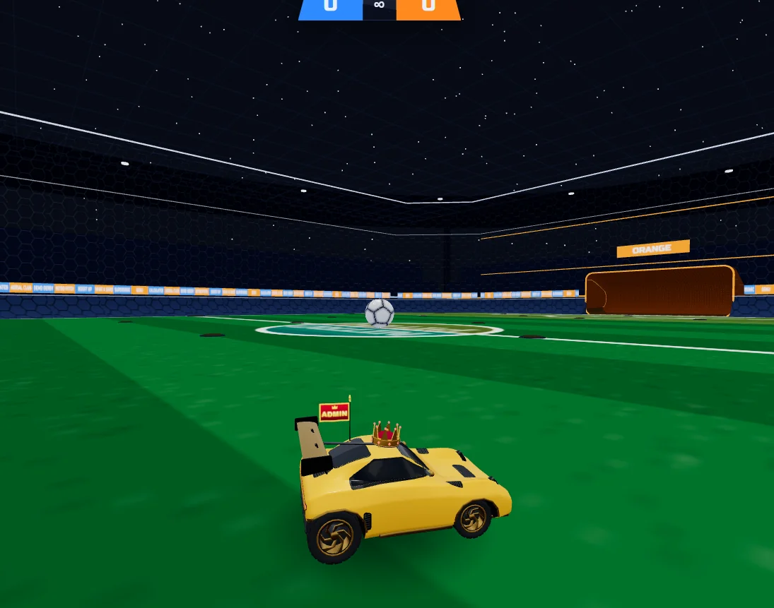 A gold car beside the soccer ball in Nitro Pitch’s indoor arena